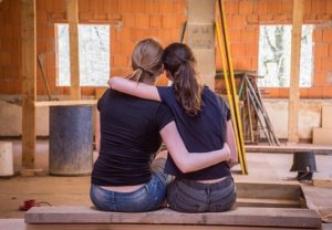 two women doing house finishing